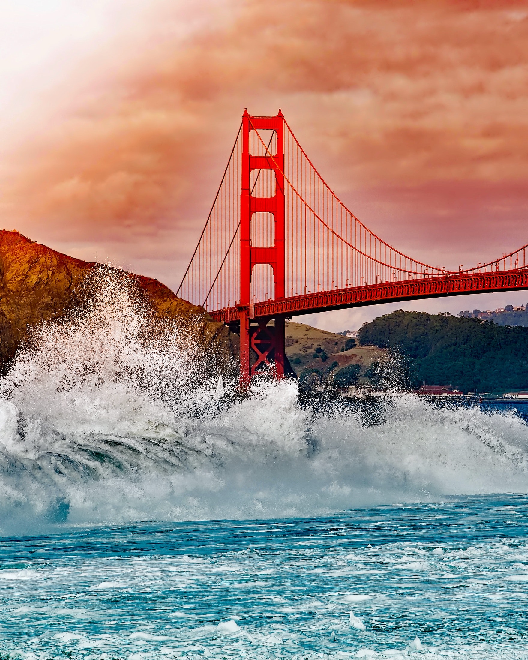 Water splashing on the rocks near the Golden Gate Bridge
