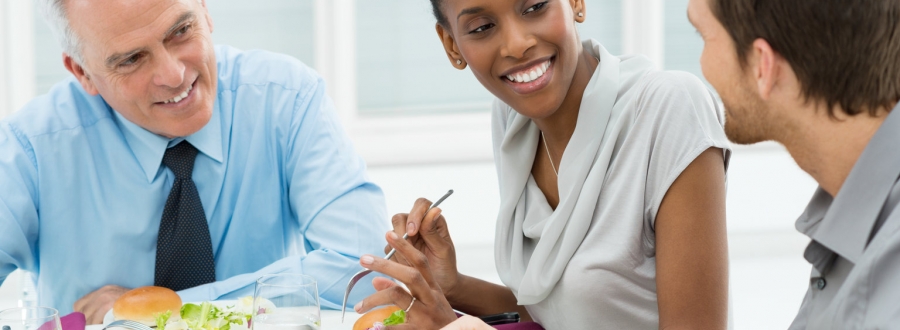 Three people at a business lunch