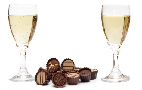 Two glasses of champagne and some chocolates