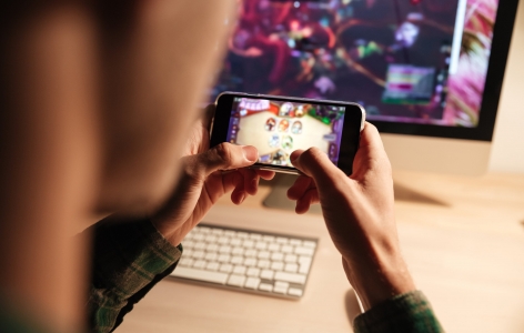 Man playing a mobile video game