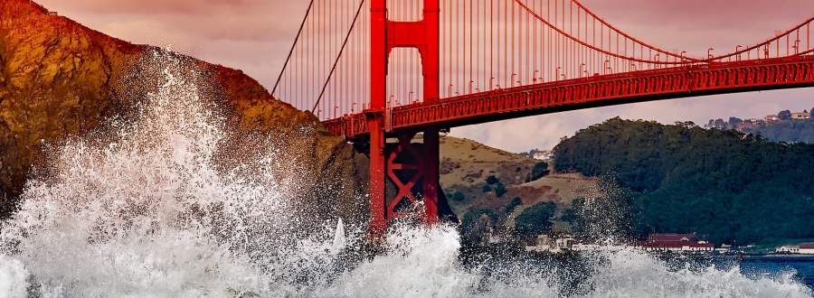 Golden Gate Bridge with Water Splashing on Rocks