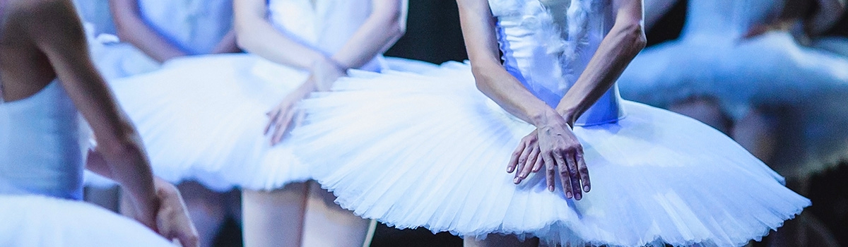 Group of ballet dancers in white tutus