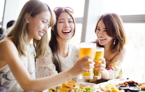 Friends dining and enjoying a beer