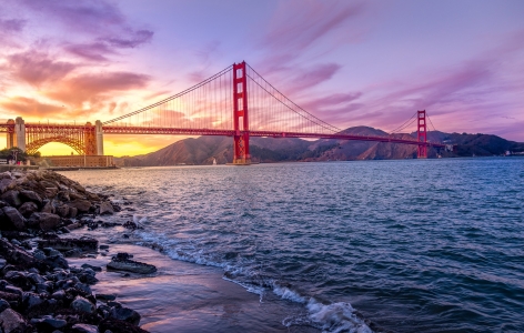 Golden Gate Bridge at Sunrise Beneath a Purple Sky