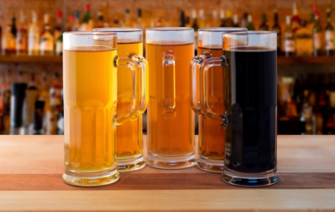 Five mugs of various kinds of beer
